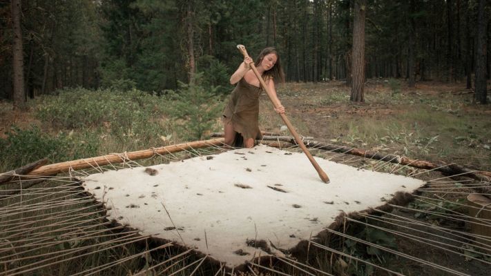 Student softening a bison hide