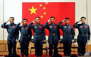We salute you, comrades! Six taikonauts in front of the Chinese flag.