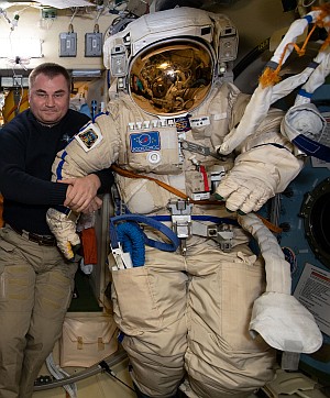 Cosmonaut Aleksei Ovchinin with his Orlan spacesuit